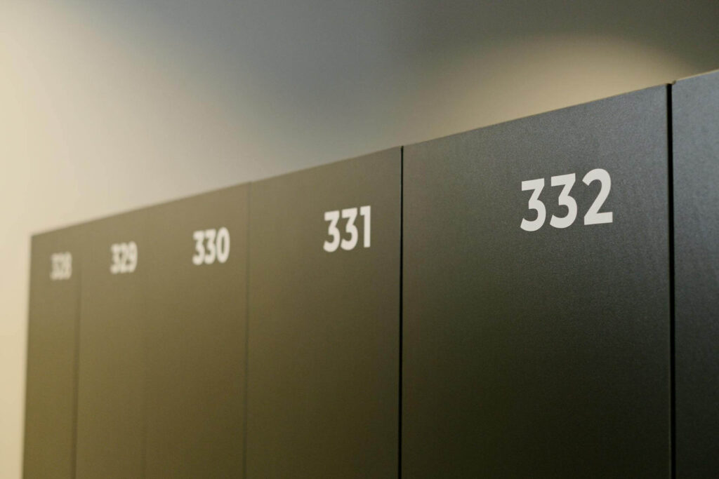 Fitting room numbers by Mark Bric Sizers for efficient retail organization in apparel stores.