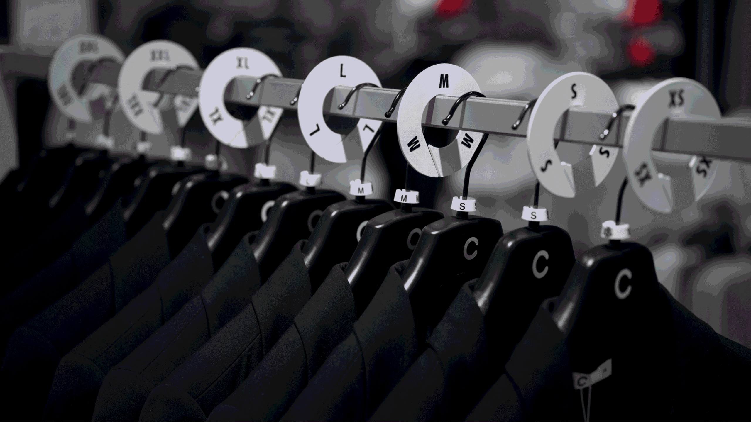 Sizer rings for clothing racks in store