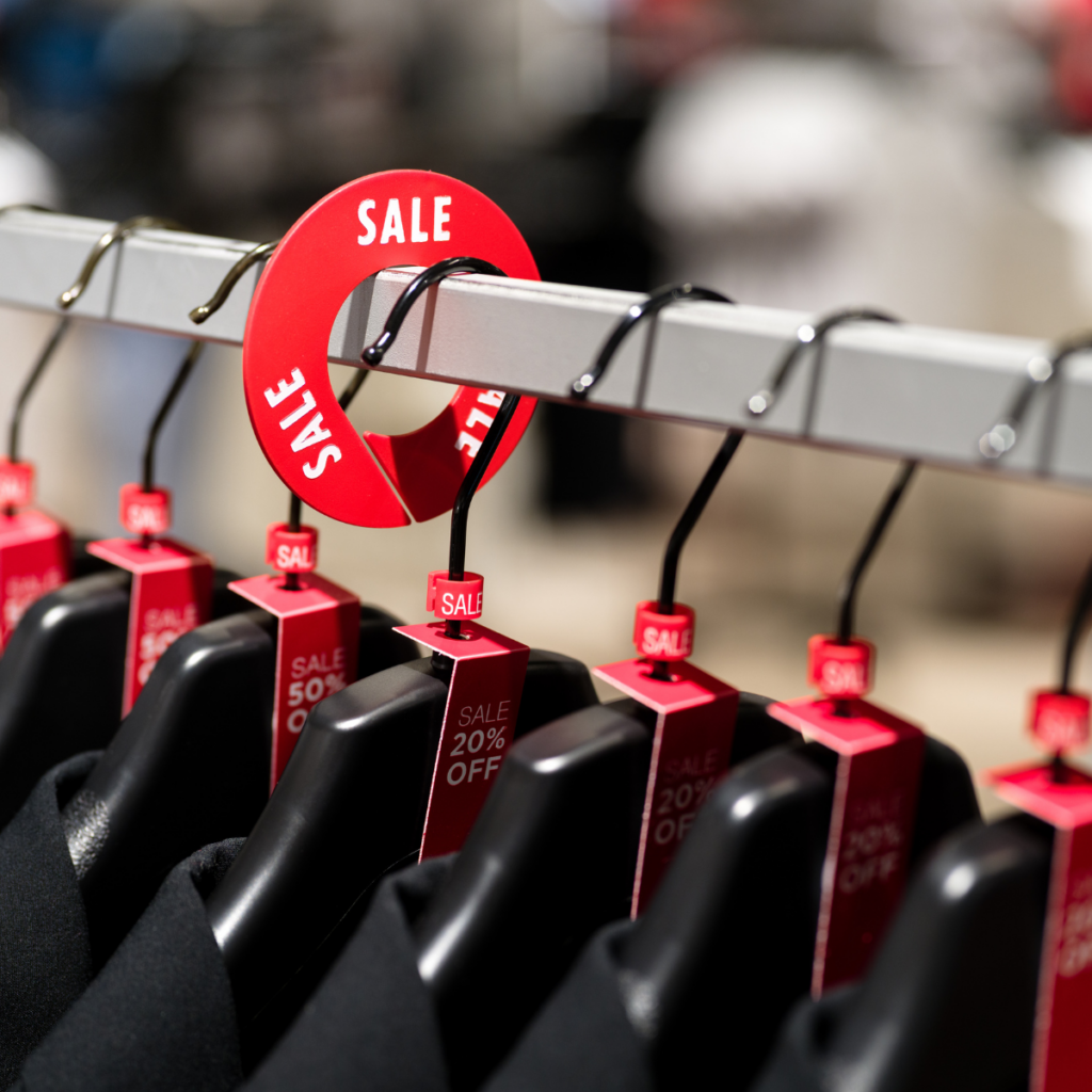 Sale rack dividers and size markers on a clothing rack