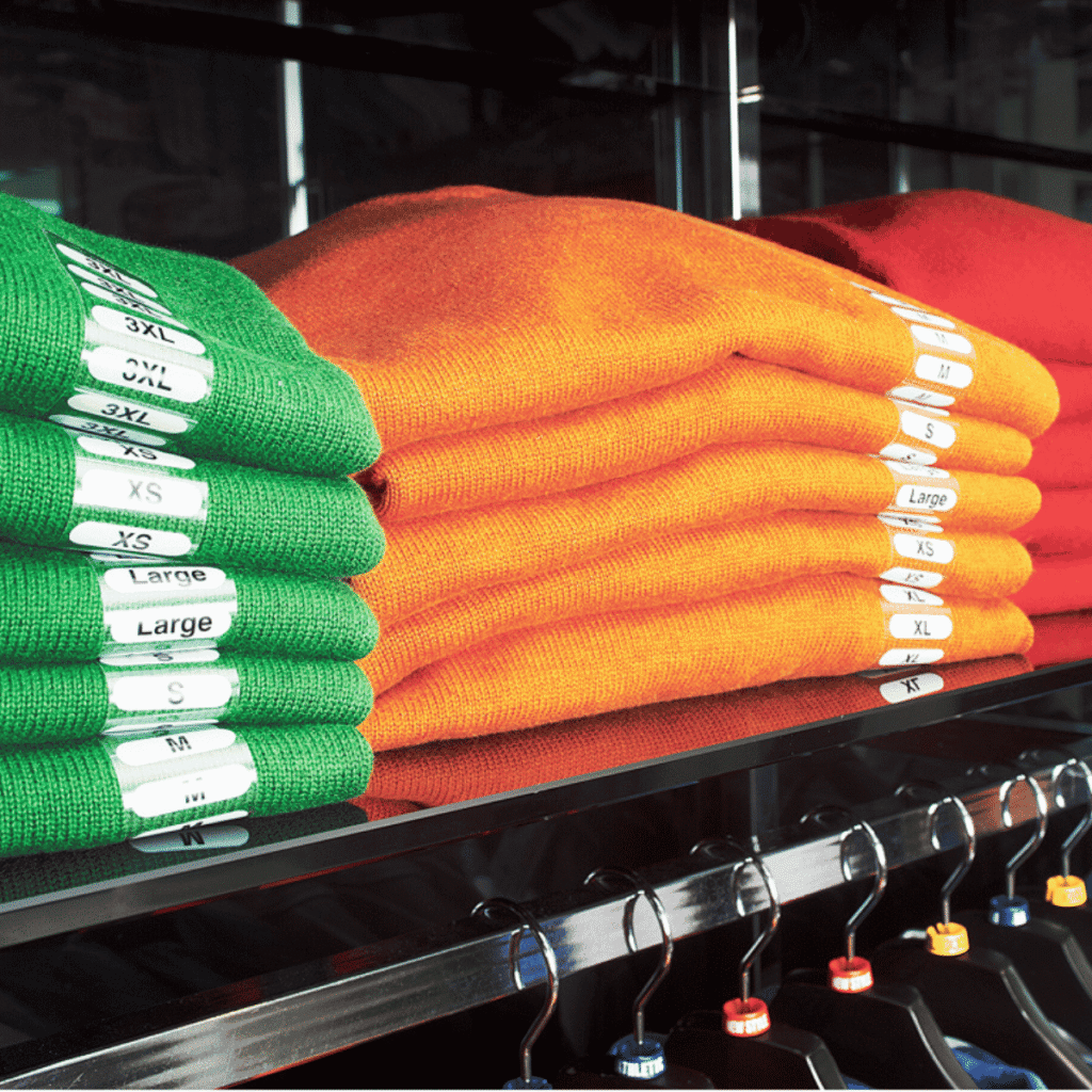 Size Labels on sweaters in a store